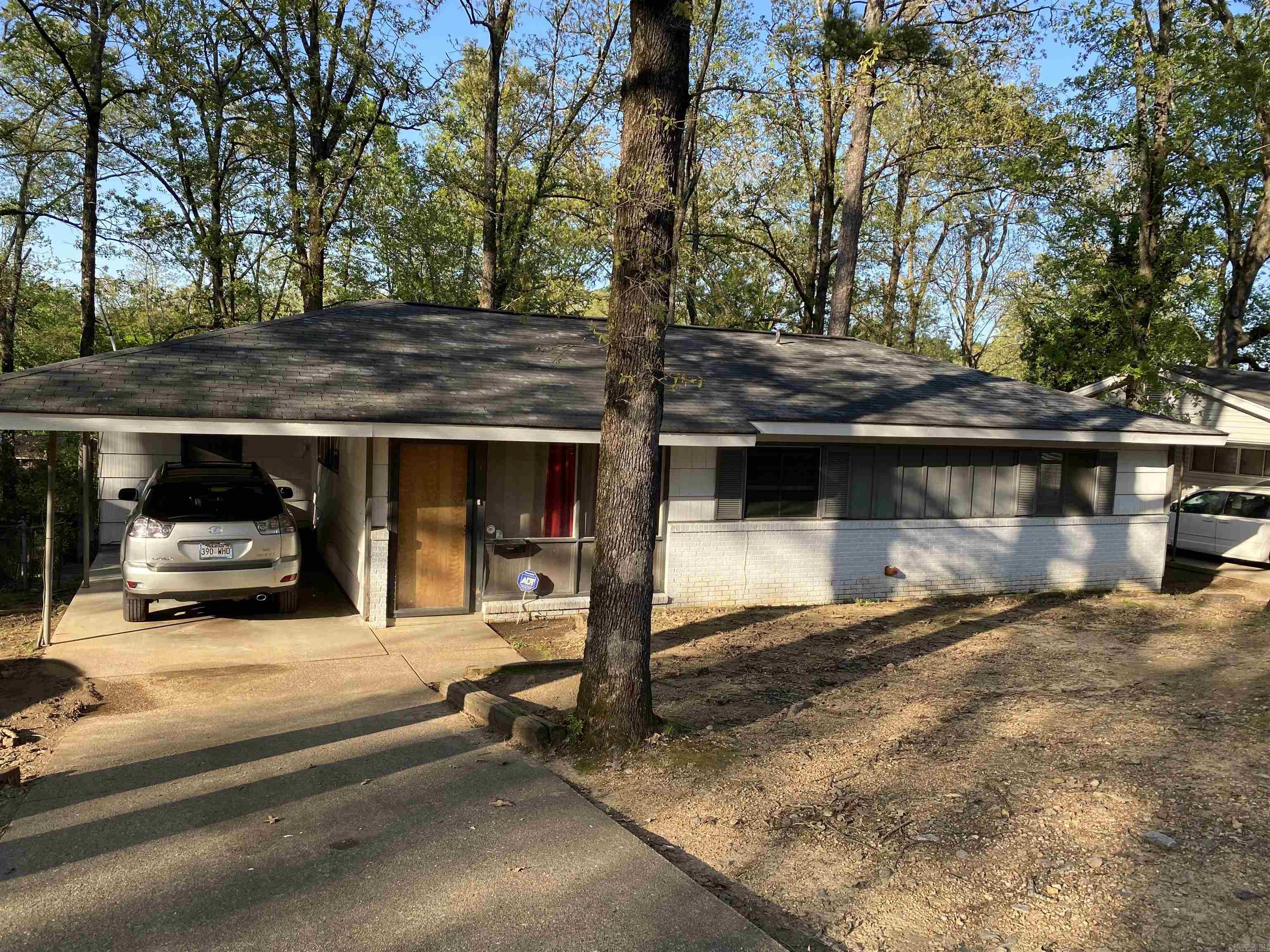 Take a look at this 3 bed 1 1/2 bath home. Open floor plan with covered parking, tile flooring with carpet in bedrooms. Nice deck overlooking a beautiful tree shaded yard with lots of room for entertaining and outdoor activities. Living, dining and kitchen are open with built in bookcase and small island. Fresh neutral paint, tile floors and lots of natural light set the stage for a few more updates. SEE AGENT REMARKS