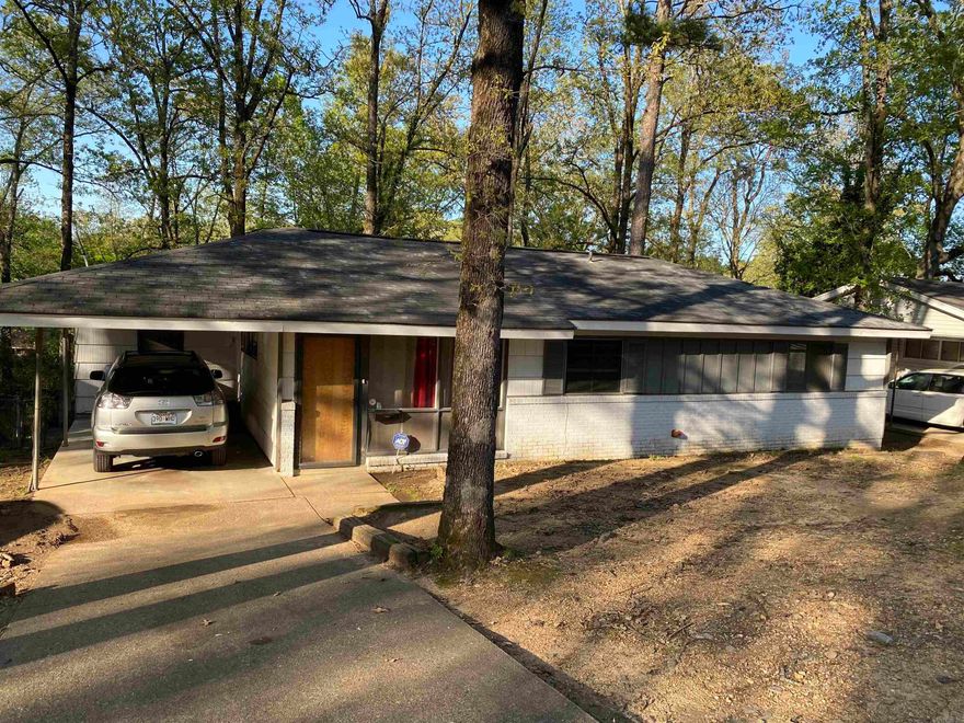 Take a look at this 3 bed 1 1/2 bath home.  Open floor plan with covered parking, tile flooring with carpet in bedrooms. Nice deck overlooking a beautiful tree shaded yard with lots of room for entertaining and outdoor activities.  Living, dining and kitchen are open with  built in bookcase and small island. Fresh neutral paint, tile floors and lots of natural light set the stage for a few more updates.   SEE AGENT REMARKS