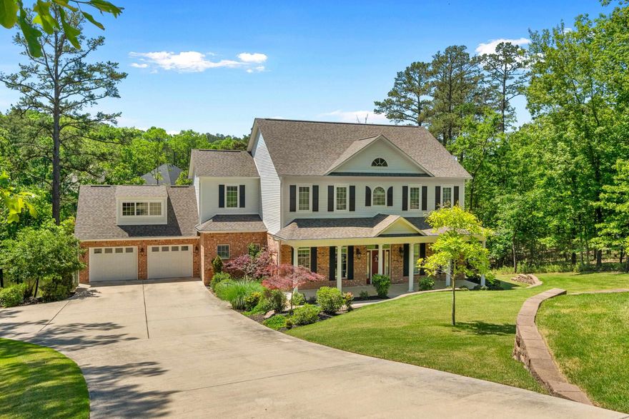 COME AND VIEW THIS BEAUTIFUL LAKE HAMILTON HOME on the outskirts of DRIFTWOOD ESTATES!  There is absolutely no sacrifice on space or quality and this is an outstanding location with 120'+ of lake frontage, wooded lots for privacy on each side, a double covered boat dock with lift, and huge covered porches to enjoy the water!  Below the home is a full walk-in basement for dry storage!  INTERIOR features include hardwood, wide plank flooring throughout, a chef's kitchen with an ice maker, a dual energy range/oven and warming drawer, lots of cabinet space and a walk-in Pantry; the open Family Room and Kitchen areas lead one way to a lovely Dining Room - and the other way to a Cozy Breakfast Nook also with views of the lake!  The Master Suite leads to the bathroom suite and nicely organized walk-in closet. The Office,  Walk-In Pantry &  Laundry Room are on the Main Floor.  Upstairs are 5 Bedrooms and 3.5 Bathrooms to accommodate all the children, grandchildren or guests!  This is a fantastic buy for Lake Hamilton in beautiful Driftwood Estates!