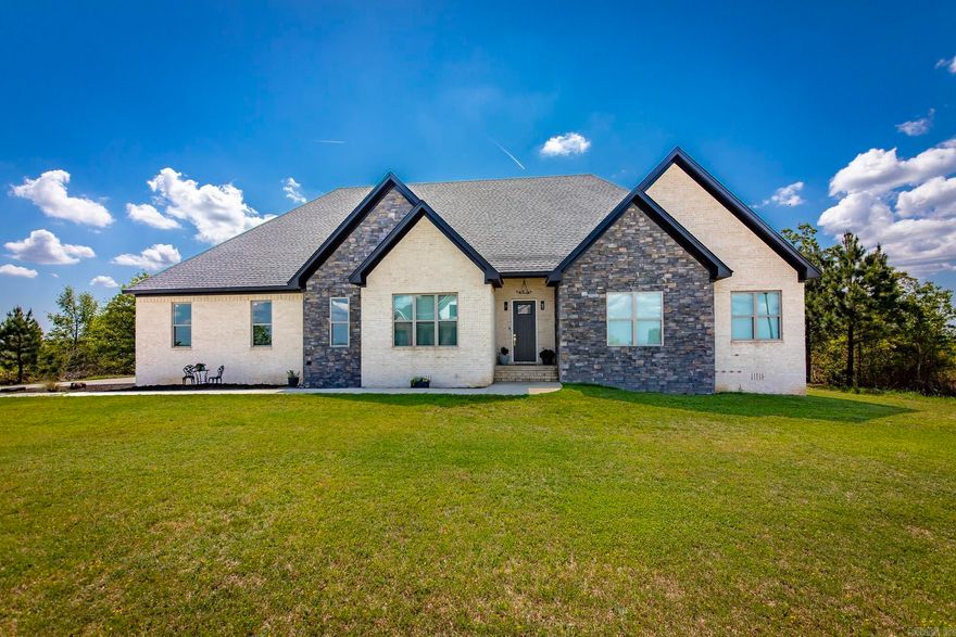 Tucked inside the gated Seven Point Lake community, this beautifully updated custom home checks all the boxes. With 4 bedrooms and 2 baths, the layout is both stylish and functional, featuring a spacious family room with luxury vinyl flooring that flows right into the kitchen—perfect for everyday living and entertaining. The kitchen offers a breakfast bar, plenty of storage, a walk-in pantry, and a clever passthrough cabinet that makes cooking and hosting a breeze. The primary suite is your private escape with a custom-tiled walk-in shower featuring a rain shower head, a generous walk-in closet, and direct access to the back porch where mountain views steal the show. Surrounded by natural beauty and tucked behind the gates, this home offers comfort, privacy, and that “this is the one” feeling the moment you walk in.