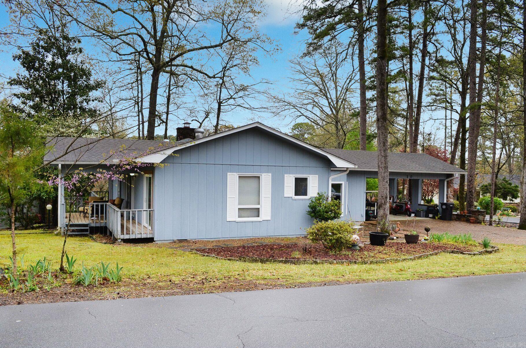 This charming home is on a corner lot with common property on one side. Located at the West End of Hot Springs Village, you are close to many restaurants, shopping, and other amenities such as pickleball courts, an outdoor pool, Lake Desoto, miniature golf, and Desoto Beach. A short ride in your golf cart takes you to Desoto Golf course and restaurant (if you don't have a golf cart, the homeowner's golf cart is for sale). Home has a workshop or hobby room in the crawlspace. Hot Springs Village has nine golf courses, 11 lakes, pickleball & tennis courts, a fitness center, and 28 miles of hiking trails. Hot Springs Village has a one-time buy in fee of $2,000 paid at closing.