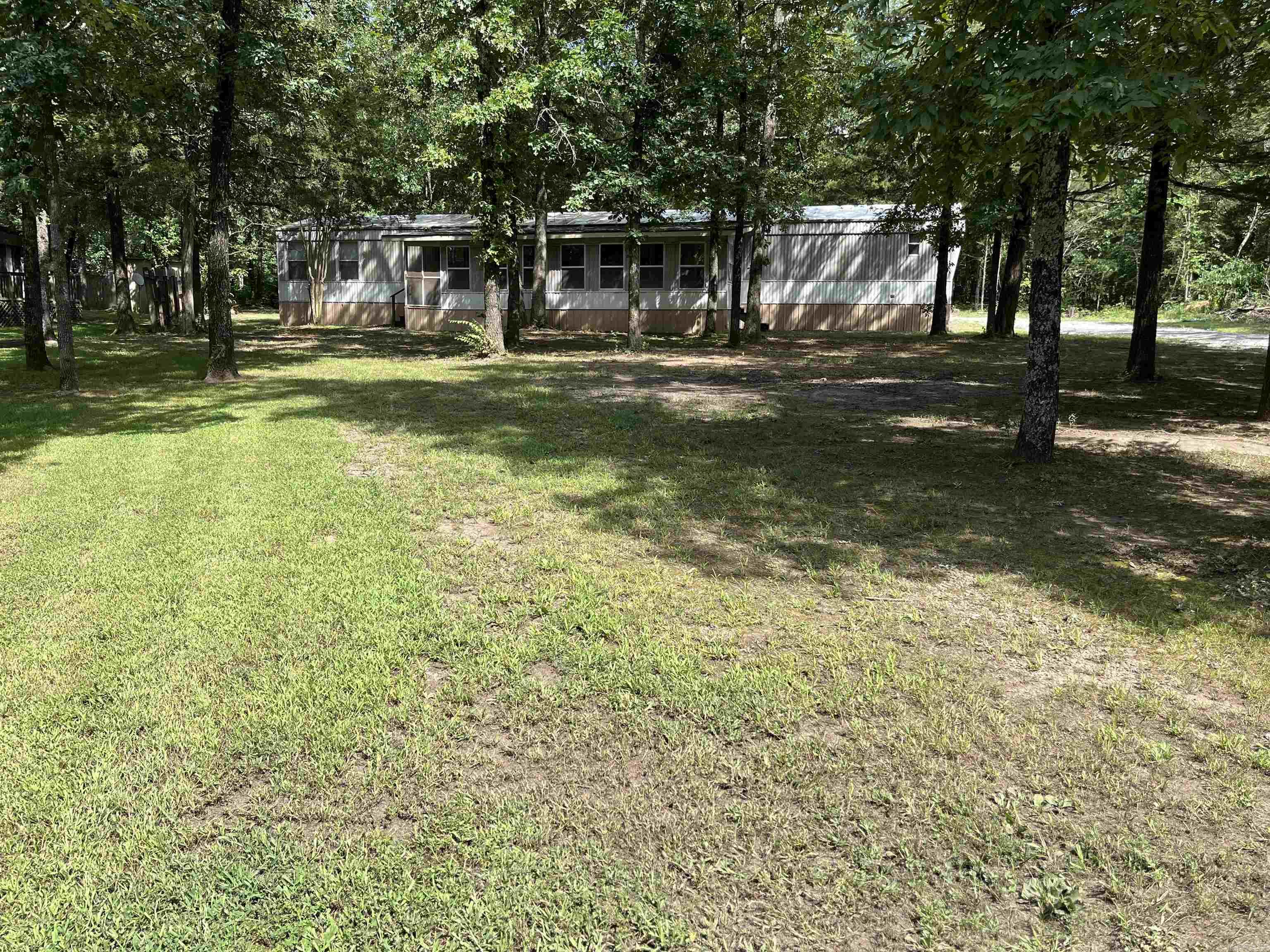 This 4 Bedroom 2 Bathroom mobile has been updated with new AC unit, new carpet, new flooring in bathroom, new appliances, and washer and dryer stays! Has a 30x35 covered storage that has electric with the middle section being on concrete and a garage door that has a 10ft wide door by 7'10" tall opening. Perfect for storing your lake toys! Just pack your clothes and you're ready to go because it comes furnished! Less than a mile to Sugar Loaf Marina! Call today to see!