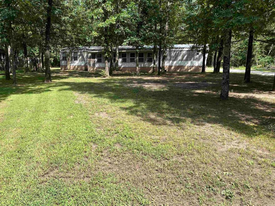 This 4 Bedroom 2 Bathroom mobile has been updated with new AC unit, new carpet, new flooring in bathroom, new appliances, and washer and dryer stays! Has a 30x35 covered storage that has electric with the middle section being on concrete and a garage door that has a 10ft wide door by 7'10" tall opening. Perfect for storing your lake toys! Just pack your clothes and you're ready to go because it comes furnished! Less than a mile to Sugar Loaf Marina! Call today to see!
