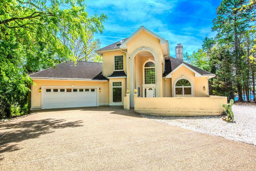 Stunning Lakefront Retreat on a Quiet Cul-de-Sac Wake up every day to an unforgettable panoramic lake view in this beautifully appointed lake house, perfectly positioned on a peaceful cul-de-sac. Designed for both relaxation and entertaining, this home blends timeless comfort with elevated custom finishes throughout. Property Highlights Expansive lake views from the main living areas and primary suite Private dock with space for two boats—ideal for lake lovers and weekend adventurers Two fireplaces offering cozy ambiance Deck off the primary suite, perfect for morning coffee or sunset unwinding Custom master closet with thoughtful organization and premium craftsmanship Solid brass, high-end bath fixtures adding luxury and durability Custom drapes and blinds throughout the home for a polished, designer feel Gourmet Kitchen A chef-ready kitchen featuring: Custom cabinetry with abundant storage Profile double oven for effortless hosting JennAir stovetop for precision cooking Located in desirable Hot Springs with all that has to offer