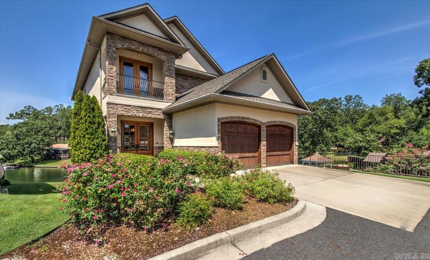 Beautiful lake living in this intimate community of six high end townhomes. Filled with natural light and gorgeous lake views, this home will wow you and your guests. Master suite and one guest bedroom suite are on a separate floor from all other living areas for privacy. Balcones grace each level with dramatic lake views. Features include an elevator, surround sound, security system, tankless hot water, and a covered boat slip. Take a look and see how easy lake living can be. See agent remarks.