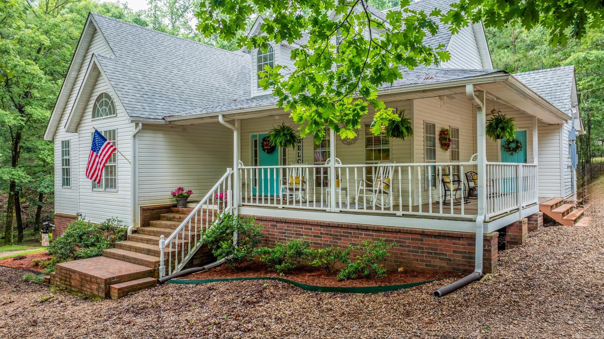 Just six miles from West Little Rock shopping and restaurants - This private oasis on five acres is ready for you to call it home! Boasting an open concept living/dining/kitchen with tall ceilings bringing in ample natural light. Primary suite features a walk-in closet, spacious double vanity with shower and soaker tub. Just off of your kitchen is a flex space that would be ideal for those wanting a reading retreat/office/formal dining or great location for homeschooling needs. Upstairs you will find two more spaces that can be bedrooms or bonus areas with a half bath in between. Step outside to endless possibilities - plenty of room for a garden, animals, or even a future pool or shop. Whether you are sipping coffee on the wraparound porch, or exploring your acreage, this property offers the space and freedom to live your dream lifestyle. A move-in ready gem combining rural charm with modern comfort. Don't miss your chance to own a slice of country paradise! Roof - 2022; Upstairs HVAC - 2025; Well/Septic/Propane all serviced 2024. (Agents see remarks)