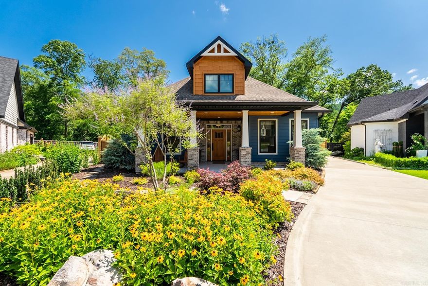 This eco-friendly green build is an absolute dream! Welcome home to Tranquil Tupelo. You will drive up to this cul-de-sac oasis and be greeted with a thriving landscape intentionally designed for year-round enjoyment. Step inside to thoughtful design features like real wood flooring, built-ins, a grand screened in rear porch with gas log fireplace and wood vaulted ceiling, plus so much more! Explore the three full bedrooms on the main level, one of which is designed to function as either a bedroom or office, and the additional spare bedroom with full bath between. You have an oversized laundry space with mud area just inside from the garage. Upstairs you will find another bedroom, full bath, and game/bonus room with wet bar and mini fridge. More built-ins ensure that everything has its place. Check out the floored attic space to fully appreciate the green features that make this home so energy efficient! Out back you will find a covered patio, separate fire pit area, and additional exquisite landscape. Need space to store tools or have a workshop? This home has a full-size single bay separate shop just past your garage. This truly has all you want and more!