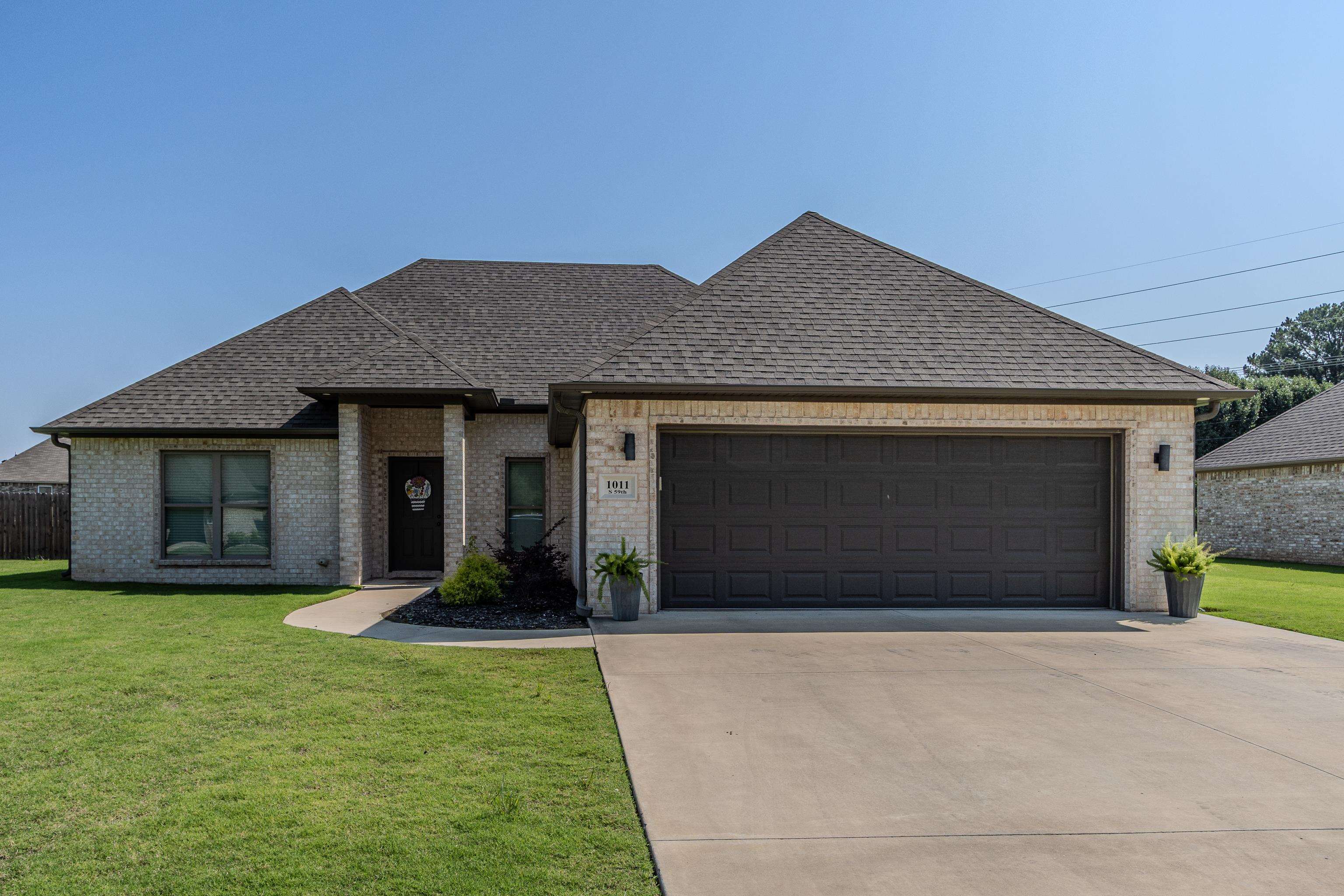 Experience modern living at its finest in this beautifully designed home with an open floor plan that combines style and functionality. Striking black pebble backsplash, elegant granite countertops throughout, and eye-catching modern light fixtures add a sophisticated flair to every room. Enjoy privacy with a thoughtful split-bedroom layout. The serene primary suite features a charming tray ceiling, a spacious walk-in closet, and a luxurious bathroom complete with split vanities, a relaxing tub, and a separate shower. Everyday convenience is enhanced with a walk-in laundry room and a generously sized walk-in pantry. The two-car garage offers ample storage and easy access. Step outside to a fully fenced backyard where you can relax or entertain on the patioāperfect for enjoying outdoor living. This home combines contemporary features with timeless comfortādonāt miss your chance to make it your own!