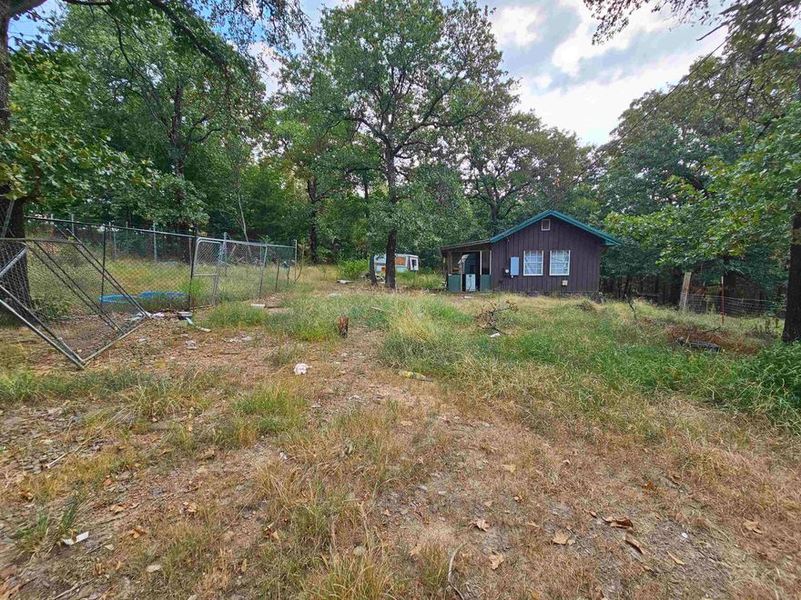 Tiny home on three acres! Country living outside of the city limits. This fixer upper tiny home has endless opportunities! This could be a hobby farm, air bnb, permanent residence or a great place for you to enjoy for the weekend to windows down and re-coop for your week. This property will require a clean up and TLC.