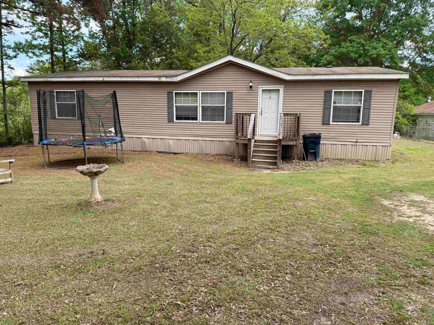 Discover the perfect blend of comfort and peaceful country living with this charming home, ideally located just outside of town. Featuring an oversized living room, this home offers plenty of space to relax or entertain. Enjoy the outdoors with built-in front and back decks. The spacious master suite is a true retreat, complete with a luxurious en-suite bath that includes a jacuzzi-style tub, walk-in shower, dual vanities, and two walk-in closets. With 3 bedrooms and 2 bathrooms, this home provides both comfort and functionality.