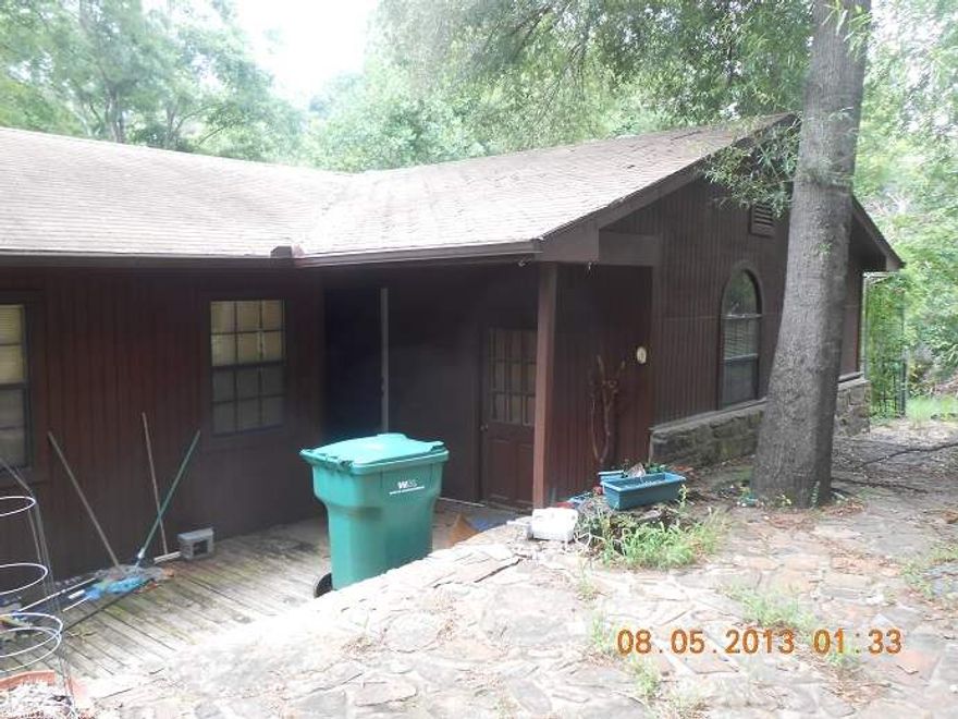 This three bedroom, 2 bath home sits on 4.95 acres with decks totally surounding the home.  This home offers a 2 car detached garages.  I has a large great room with a small study. It is great home with lots and lots of space and total privacy.  because this is a Freddie Mac "First Look Home" which provides home owner occupants first opportunity to purchase this home during the first 15 days of the listing period.  This time will expire February 3, 2014.  After that time it is available to every one.