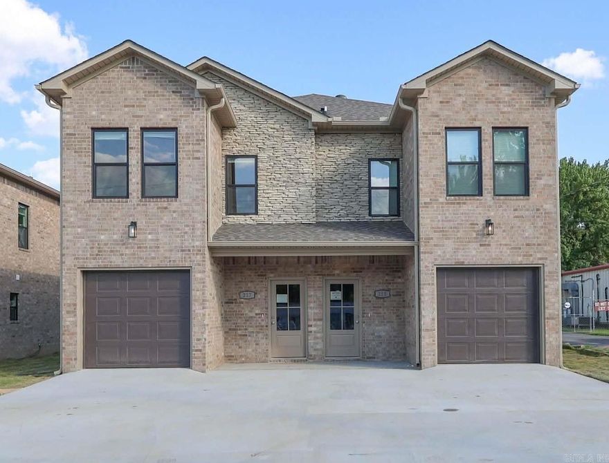 Turnkey new construction duplex offering modern design, premium finishes, and a location that consistently attracts renters. Situated near Little Rock Air Force Base with easy access to downtown Little Rock, this all-brick property is designed for long-term ownership and reduced operating costs.  Each townhome-style unit includes 3 bedrooms, 2.5 baths, a one-car garage, and an open main living area with a convenient half bath. The second level features a primary suite with private bath and walk-in closet, two secondary bedrooms with a shared Jack-and-Jill bath, and an upstairs laundry room.  Interior features include quartz countertops, custom cabinetry, luxury vinyl flooring, energy-efficient windows and doors, blown-in insulation, and new kitchen appliances.  Walkable to grocery stores, home improvement retailers, dining, and neighborhood amenities. Additional shopping, parks, and recreation are just minutes away.  Images shown are from a prior build of similar design and finishes. Projected completion/CO in 2026. Sale includes both units.  6 other units available in the area. Call for more details.