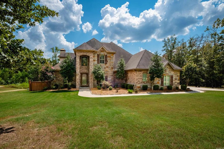 Exceptional home on 5 acres in the Westcliffe subdivision.  This home has a deck overlooking large pond.  Covered porch has views of oversized pool with diving board area, sport court area, hot tub and sunbathing area.  Main level boasts arched brick openings, dining room, office with coffered ceiling, hearth room has oversized fireplace with open kitchen.  Main level primary bedroom with sitting area and large luxurious bath.  Upstairs has two bedrooms with shared bath.  Additional bedroom with hall bath that shares with bonus room (this could be 5th bedroom) and balcony overlooking pool.  Fenced area for dogs.  Home has three car attached garage.  Separate detached garage/workshop 1546sf with room for 7-8 cars or drive your boat through front and back garage doors.  Efficiency apartment/in-law quarters with full kitchen, full bath, laundry and storm room.  This has it all.  Come see!