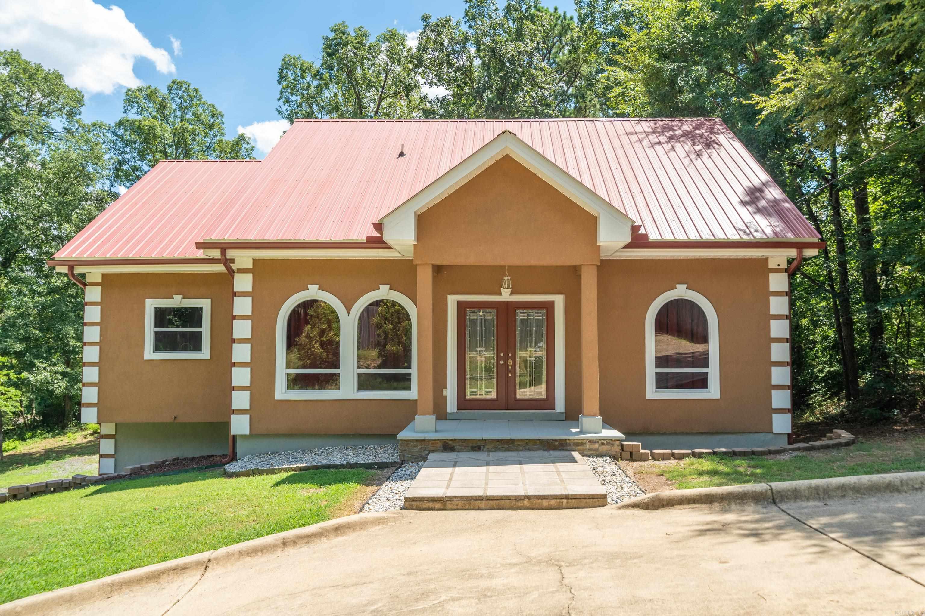 Discover this completely remodeled home offering the perfect solution for multi-generational living or savvy investors seeking dual income potential. This impressive 5-bedroom, 4-bathroom home spans 3,615 square feet and cleverly features two separate living spaces that could make even the most territorial in-laws smile with appreciation. The downstairs living area comes equipped with its own full kitchen, creating an ideal setup for two families to coexist harmoniously without disputes over refrigerator real estate. Whether you're housing college kids, aging parents, or running a rental operation, this flexible floor plan adapts to your lifestyle needs. Fresh renovations including crown molding throughout ensure modern comfort and style, while the generous square footage provides ample room for everyone to spread out. The thoughtful design maximizes both privacy and togetherness, making family gatherings enjoyable rather than overwhelming. This property represents a rare opportunity to own a versatile home that truly works as hard as you do.