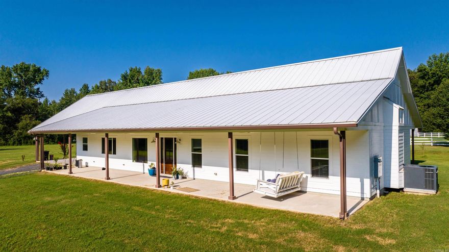 Nestled on 20 acres of picturesque countryside, this spacious farmhouse is the perfect retreat for those seeking peace and tranquility. With 3 bedrooms, 2 and 1/2 bathrooms, office, playroom and 3200 square feet of living space, this home offers ample room for family and guests to spread out and relax. Inside, you'll find a cozy living room, a fully-equipped kitchen with stainless steel appliances, and a large dining area that's perfect for entertaining. All this and fiber gigabit internet. Outside, the wrap around porch is perfect for enjoying your morning coffee while taking in the stunning views of the surrounding countryside. The 20 acres of land offer endless opportunities for hunting, gardening and so much more. Don't miss your chance to own this stunning farmhouse and make your country living dreams a reality!