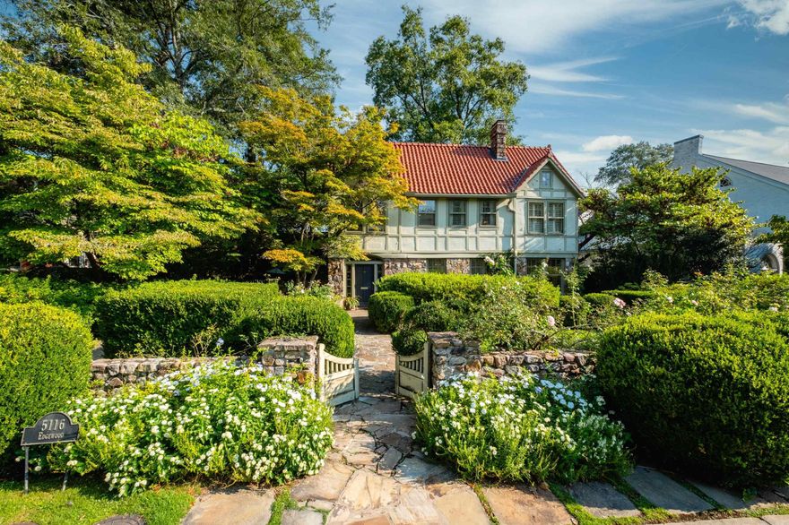 Classic Historic Tudor revival in Prospect Terrace. This beautiful property with English gardens designed by P. Allen Smith, sits on a 1/4 acre & has multiple areas for entertaining both inside & out. The foyer w/natural light filtering in opens to formal living room w/built in bookcases & see through fireplace to the study. Study w/fp, bookcases & ample windows w/ solid wood shutters. Separate dining room w/french doors overlooking stone patio w/fountain. Chefs kitchen open to 2nd dining area, large den & fireplace. Kitchen w/solid pine cabinets, laminated solid pine countertops, double oven, warming drawer & island with built ins. Butlers pantry off kitchen w/tile flooring, glass front cabinets, granite countertops, wine closet & bay window overlooking the stone patio, fountain & side garden. Also on main floor is walk in pantry & half bath. Upstairs primary suite w/sitting area, built ins, huge primary bath w/double vanity, tub, walk in shower & walk in closets. Also up is laundry, guest room w/ sitting area and ensuite bath, 2 other guest rooms share hall full bath. Walk up floored attic could be extra living space. Backyard cottage with bedroom & bath. Full house Generator!