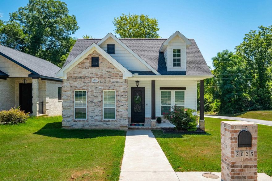 Gorgeous contemporary home offering the perfect blend of modern design and functionality, with a sleek monochromatic color scheme throughout. Located just three minutes from downtown, you'll be steps away from top-rated restaurants, attractions, and vibrant city life—yet tucked away on a quiet corner lot with a spacious yard. Trayed Ceilings with Crown Molding adding elegant touches. Hardwood Floors throughout, with ceramic faux marble floors. Black Matte & Modern Lighting Fixtures that complement the home's sleek design. Spacious Closets with built-in shelving for optimal storage. A corner lot with ample yard space for entertaining. And an amazing dual sided fireplace to cozy up to throughout the home. Come take a look and be amazed! Home qualifies for 100% financing with program elgibility. Agent please see remarks.  Agents see remarks.