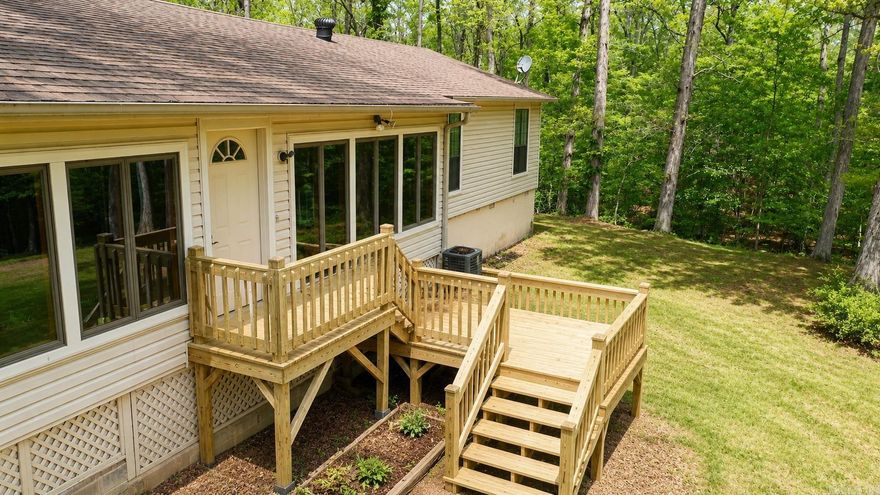 Perfect getaway near beautiful Lake Ouachita in Mount Ida, AR! Whether you're looking for a full-time residence, vacation home, or an income-producing VRBO, this property checks all the boxes. This move-in ready home has been thoroughly cleaned, including all carpets, and is ready for its next owner. Inside, you’ll find two spacious living areas, including a stunning enclosed sunroom with a wall of windows overlooking access to Twin Creek—perfect for relaxing and enjoying the natural surroundings.  Property has easement to access Twiin Creek with trails, creek access and wildlife. The home features two bedrooms and two newly remodeled bathrooms, along with a convenient side-entry mudroom with storage and a separate laundry room. Outside, the property offers a carport with three storage areas, providing plenty of space for tools, lake gear, or hobbies. A separate bunkhouse adds even more versatility—ideal for guests or additional rental potential. Don’t miss this opportunity to own a slice of paradise near Lake Ouachita