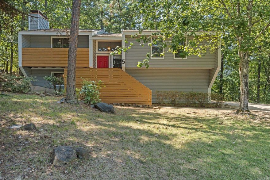 Non-Smoking two-story 4 bedroom house located on a wooded lot on a cul-de-sac in the Stone Ledge area of Maumelle. The house has a two car garage, three private decks and a patio. Inside is a Great room with wood-burning fireplace, dining room, a den downstairs, and three full bathrooms. The house has central heat and air, w/d connections, carpet and tile floors, ceiling fans, and window coverings. The kitchen is furnished with an electric stove, dishwasher, disposal, and a French-door style refrigerator.