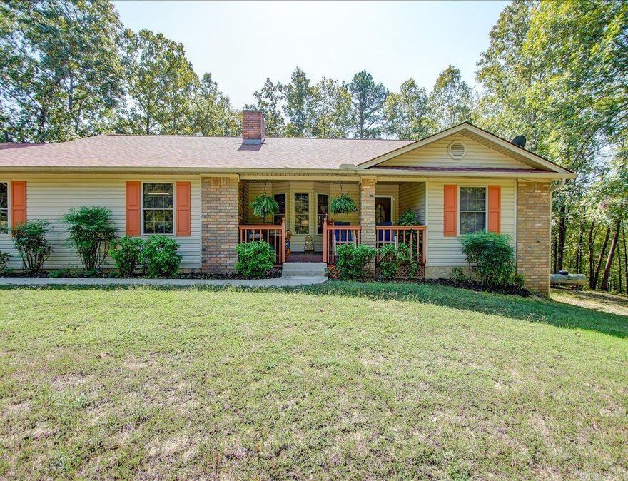 Discover this charming home in an active, quiet community.  As you enter you will be welcomed by the cozy fireplace and open living area, kitchen and dining with vaulted ceilings. The charm continues as you step out onto the covered/open deck perfect for morning coffee or entertaining guests. No need to stress out about updating, this home is ready for you to move in.(New roof, flooring, heat & air (heat pump} and washer & Dryer that conveys with the sale of the home. You are only minutes away from golfing, boating, tennis, pickleball, swimming, hiking in Lake Catherine State Park and community activities and downtown Hot Springs. But don't take my word for it, come see for yourself and experience the fun! Golf Cart and most furniture negotiable.