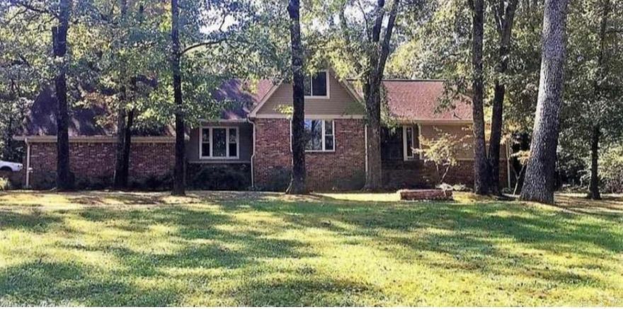 Situated on a peaceful street, this beautiful home features two living areas with tons of natural light, and a cozy fireplace. Home sits on a 3.75 acre, well manicured lot.