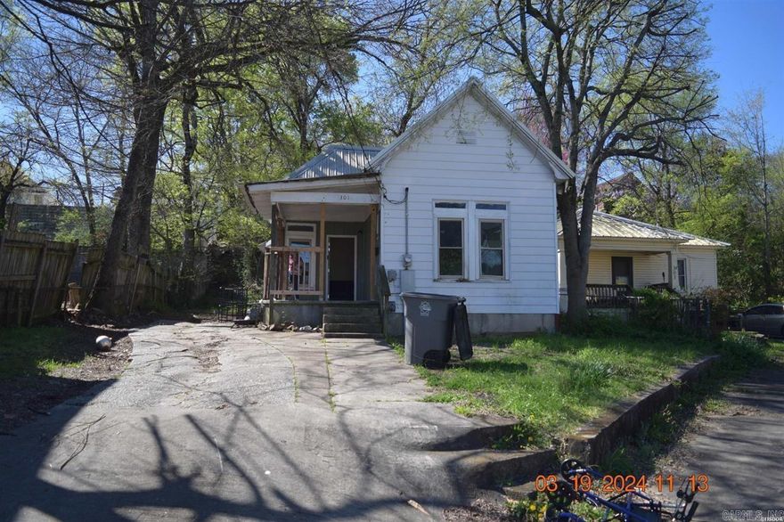 This single-family home, a fixer-upper brimming with potential, invites the discerning eye of property enthusiasts and creative real estate minds.  Boasting 1067 sq ft of space, this residence is ready to transform into your dream home.  This fixer-upper beckons the right buyer to envision the possibilities and create something truly one-of-a-kind.