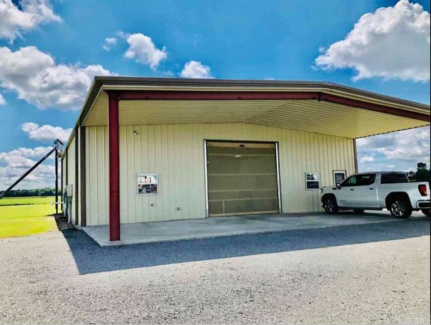 Newer constructed 3000 sq. ft. metal shop building with 15x15' office, heated/cooled kitchen, concrete foundation, huge shop with large entry and exit doors with full screens, 10 camera Simplisafe security system and monitor, wireless phone & internet, exhaust fan, sealed floors with drains, motion detectors on windows, soft water system, alarm system, food grade facility, 10,000 bushel grain bin with auger, 2,000 gal. septic system, beta cable, Direct TV, exhaust system, easy access to I40, .99 acs. Heated building with office space as well. The building is amazing and will fit just about any business.