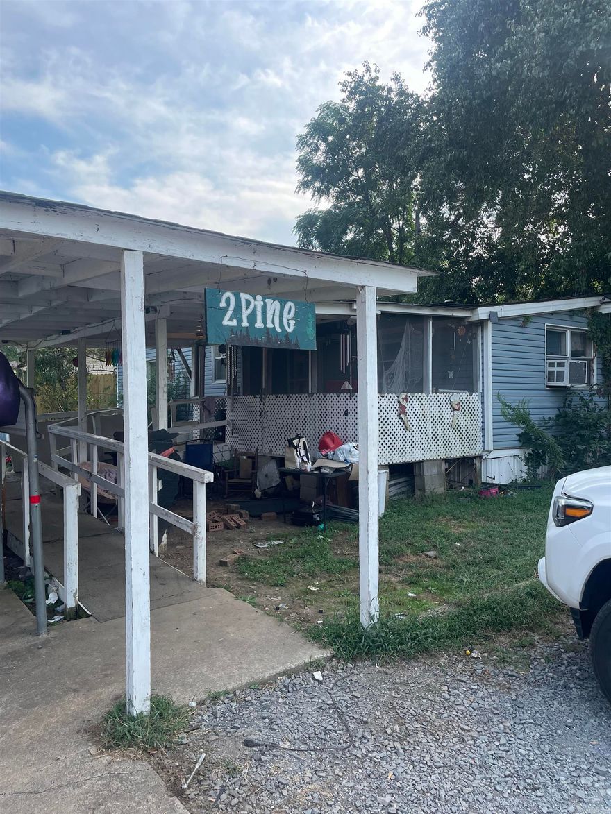 Looking for an investment near Lake Conway? This is your opportunity! With some TLC and creativity, this property can be brought back to its full glory just in time for the Lake Conway Renovation project. This home has been customized to be wheelchair accessible. The ramp inside the home is removable. An addition was made to the original single-wide mobile home in 1999, increasing the heated and cooled square footage and giving you more rooms to work with. There are two storage sheds on the property that will convey. This property is sold as-is. Agents see remarks regarding showing instructions.