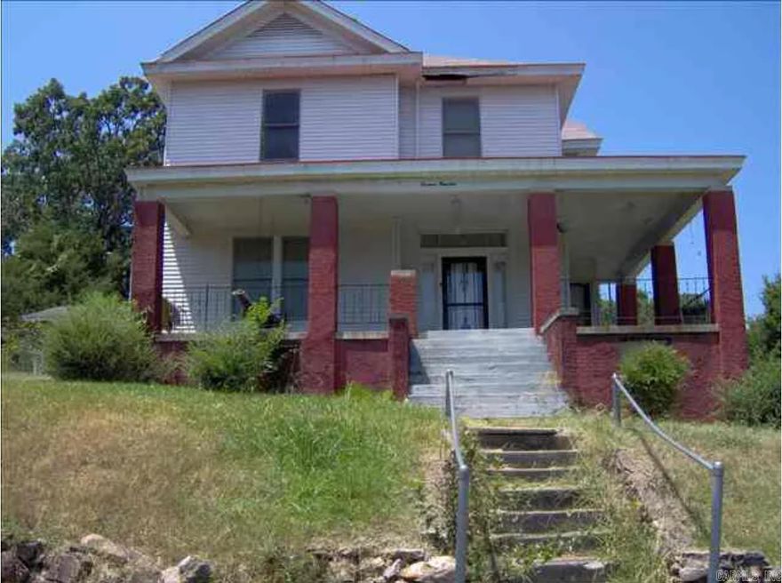 Spacious early-20th-century home offering over 2,800 square feet of living space, including an unfinished basement, situated on a generous 0.24-acre lot in Little Rock. The property features two fireplaces, two full bathrooms and a large covered porch. With its size, layout, and lot, this property offers strong potential for renovation, rental, or resale. Conveniently located with easy access to downtown Little Rock and major roadways. Property is being sold AS-IS with no repairs or warranties provided by the seller. Buyer to verify all information, measurements, and intended use.