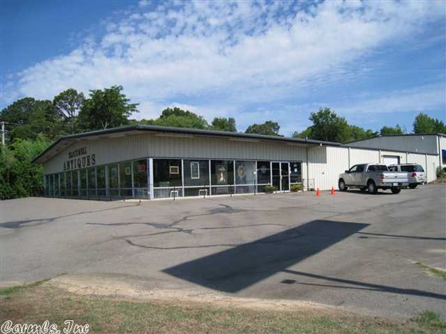 Heated & cooled retail office/warehouse, asphalt parking on I-30 at Bryant, 2 glass entry doors, 5 O/H doors, 4 restrooms, 2 office, 2800 SF storage with 3 O/H doors. Billboard sign lease $300 per month. Very visible, great high traffic location on interstate 30. Please measure for square footage accuracy.