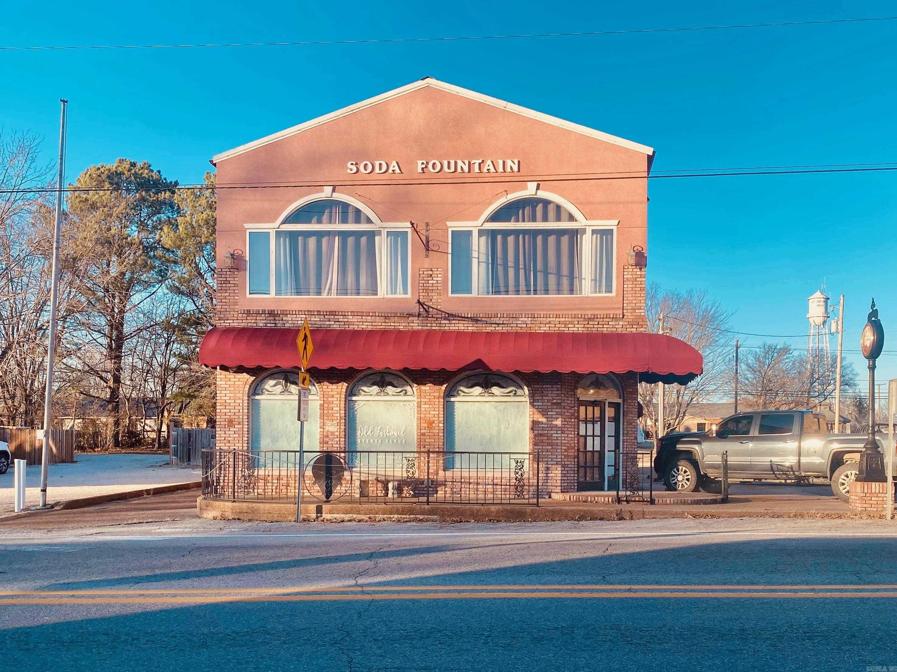 Prime investment opportunity in the heart of historic downtown Mountain View, AR! This charming, multi-use building features two established vacation rentals and a street-level retail space, all just steps from the lively music scene, shops, and restaurants the area is known for. The main level includes a welcoming 2 bed, 1 bath rental unit and a dedicated retail storefront perfect for a boutique, gallery, or coffee shop. Upstairs, you'll find a spacious 4 bed, 1 bath rental with vintage charm and modern updates, ideal for larger groups or family getaways. With high visibility and consistent rental income, this property offers the perfect blend of business and leisure in one of Arkansas's most beloved small towns. Whether you're looking to expand your investment portfolio or launch your own downtown venture, this property delivers location, income, and opportunity.