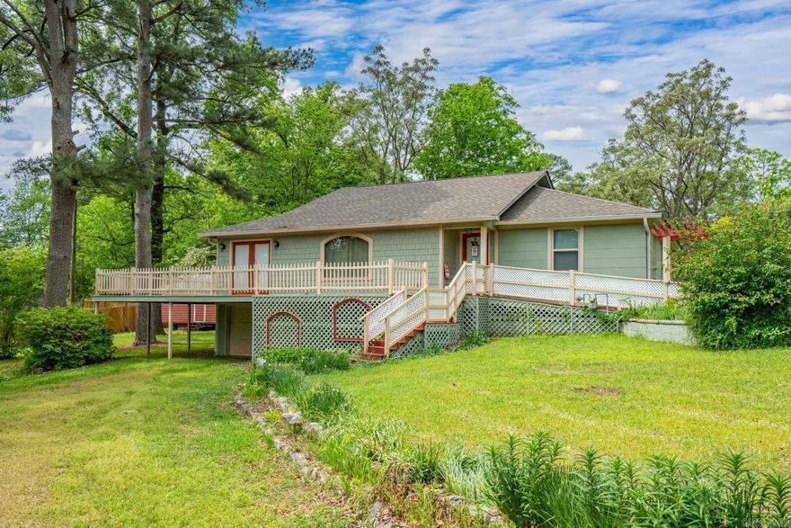 Charming Lakefront Retreat  Welcome to this delightful 2-bedroom, 2-bathroom lakefront home, nestled in a serene cove with a swim dock. Spanning 1,768 sq ft, this 1945 gem sits on a park-like lot, offering a tranquil escape with lake views. The home features beautiful wood floors throughout, adding warmth and character to the space.  With ample room for additions, this property presents a fantastic opportunity to create your dream family vacation home. While it requires some updates, the potential is limitless. A new roof installed in 2023 ensures peace of mind and longevity.  Don't miss the chance to own a piece of paradise and transform it into a stunning retreat for generations to come.