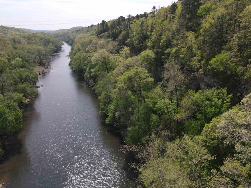 Escape to 9.2 acres +/– of scenic recreational timberland with frontage on the beautiful Little Red River. This secluded property offers the perfect mix of natural beauty and outdoor adventure, featuring gorgeous views, an impressive bluff line, and several potential building sites for your dream cabin or private retreat. Whether you love hunting, fishing, or simply enjoying the peace and quiet of nature, this land provides endless opportunities for recreation and relaxation. Located approximately 14 miles from Pangburn, Arkansas, this is a rare opportunity to own your own private piece of The Natural State. An adjoining 9.5-acre tract is also available for those looking to expand.
