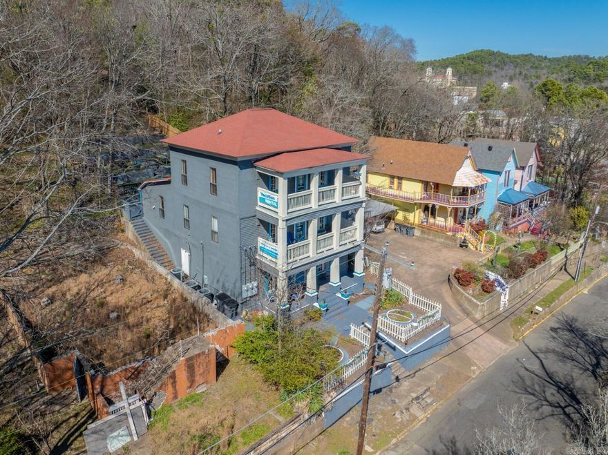 Opportunity Awaits! This is the closest short-term rental to Hot Springs National Park, and Hot Spring's world-famous Bathhouse Row. Vacationers can easily walk from this property into downtown and enjoy all that Hot Springs has to offer OR take a hike in the National forest just steps from your back door. This wonderfully restored 8 bedroom, 5 bath, home is an ideal investment opportunity anyone looking to capitalize on the 6.7 million vacationers who visit Hot Springs annually and want to be in the heart of the action in downtown. It is also very close to the convention center and is often a favorite spot for larger groups that are in town for tournaments. It is being offered fully furnished with two full size washers and three full size dryers on site. Financials available upon request. Don't miss this once in a lifetime opportunity!