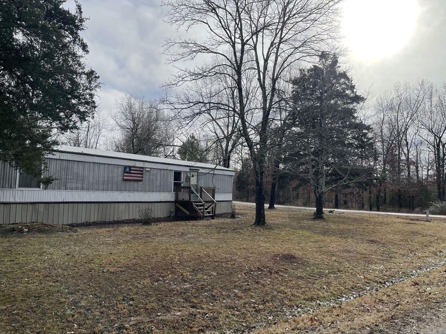 2 bedroom 1 bath home with a peaceful sitting on this nice level corner lot. Home features open concept with an each bedroom on opposite ends of the home. Covered back porch to enjoy your morning coffee. NEXT internet is available. New septic system installed in 2022.