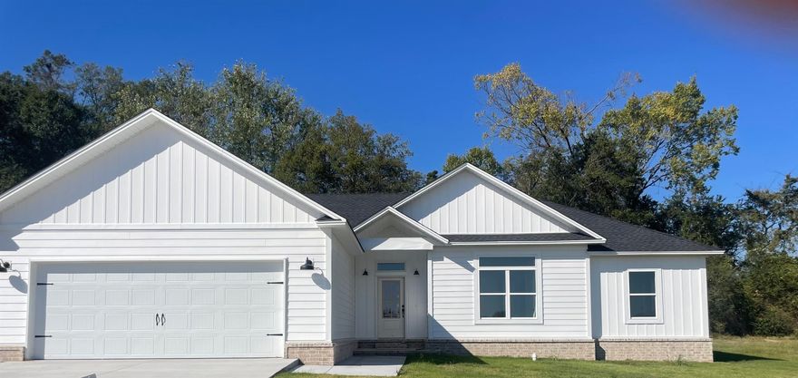 Quality throughout this 4 bedroom, 2 bath brick and siding home. Beautiful, spacious kitchen and dining with quartz countertops and walk-in pantry.Large open living room is the central focus of the home with large windows with a view to the outside covered area.  Split floor plan, beautiful custom finishes throughout.  Master bath features double vanity, separate shower and jetted garden tub, two walk-in closets, private toilet and linen closet.  Hall bath is well-designed to accommodate 3 bedrooms with door separating tub/toilet and vanity area.