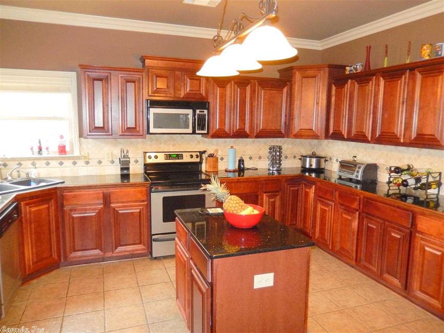 This is a FANTASTIC home with a open floor plan in a great location between Chenal Parkway and Kanis and is Convenient to Shopping and Restaurants. The cook of the home will love this knocked out kitchen with cherry stained cabinetry,island and breakfast bar. The large great room has a gas fireplace. The Master is huge and has French doors that leads to the deck that over looks the back yard. Bonus room off the garage that is heated and cooled but not included in the sqft.