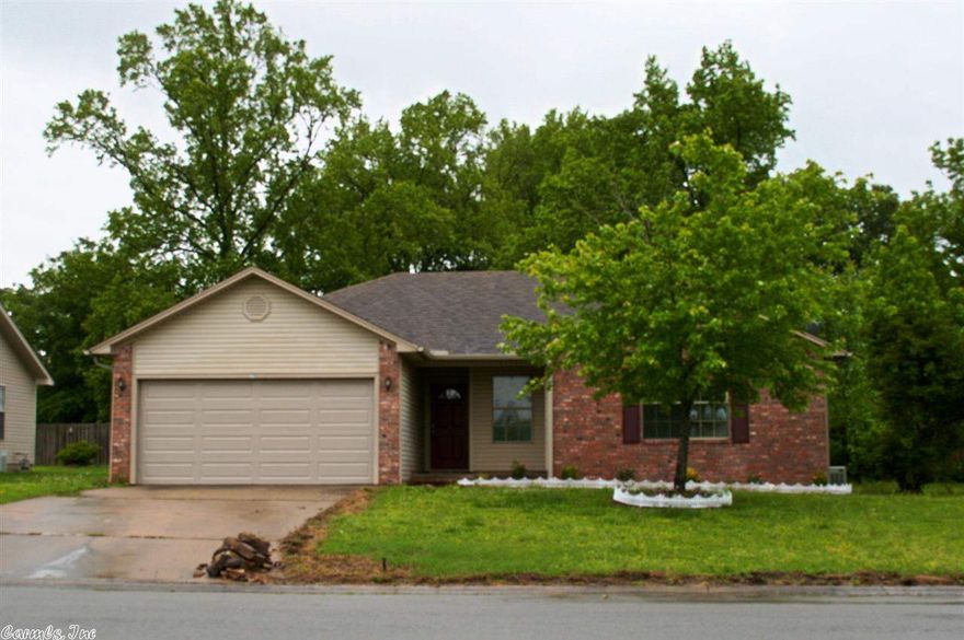 CHARMING, AFFORDABLE, & MOVE-IN READY!! This Gorgeous Home has been completely updated with New Paint & Flooring Throughout, New Appliances, Gutters & Landscaping..to name a few! A quaint Entryway opens to the Huge Great Room w/ corner Fireplace, Gorgeous Flooring & Vault Ceilings! The Master is Split with Huge Walk-in Closet & His/Her Vanities. Both Spare Rooms Large with Walk-in Closet! The Backyard is Large, Fenced and Backs up to Trees For Privacy! Great Neighborhood in the Heart of Cabot! A MUST SEE!