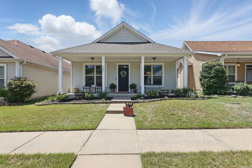 CHARMING craftsman style cottage 3 bedroom, 2 bath featuring a stunning open kitchen with granite countertops, a breakfast bar, and a spacious dining area that flows seamlessly into the living room.  A cozy gas fireplace welcomes you. Elegant tray ceilings add the perfect touch of charm. The generously sized primary suite offers a massive walk-in closet, double vanities and a luxurious jetted tub. Granite throughout.  The sunroom is pure CHARM, perfect for sipping sweet tea or curling up with a book. Come home to timeless elegance and effortless living.