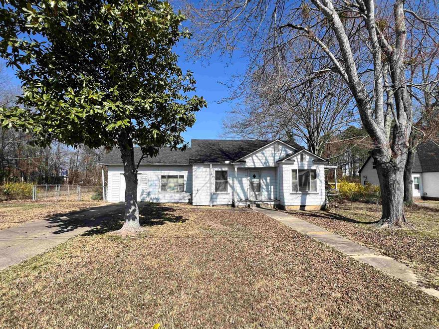 This adorable home needs just a little TLC! It could be 3 bedrooms or 2 living areas, whichever fits your needs. There's even a bonus space for office or craft room. The beautiful shade trees and mature landscaping just add to its charm! Under the carpet (in at least one bedroom) is the original hardwood flooring that could potentially be saved. The spacious eat in kitchen has possibilities galore! Two bedrooms have large walk in closets and are both suitable for king size furniture. With a little imagination and work, this could be your forever home, an addition to your rental portfolio or perfect for anyone looking to downsize. Location is excellent for walking to shops and restaurants.