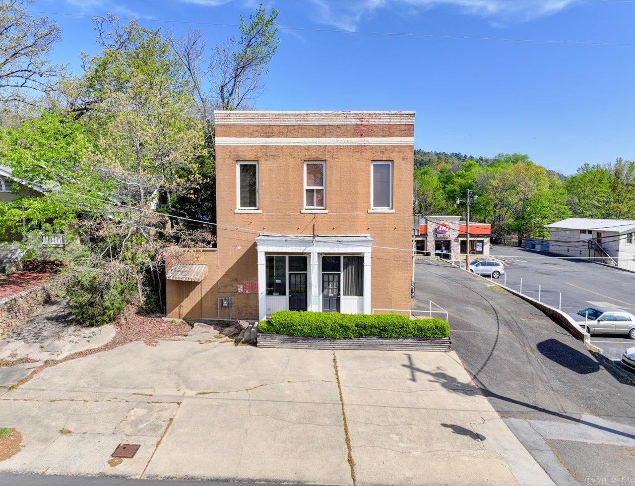 Unique property. Formerly Historic Firehouse #4. C-2 zoning. Endless possibilities. In 2017, new electrical systems, new water lines, new natural gas lines and HVAC were installed. Upstairs you will find an adorable 2 bedroom, 1 bath apartment with amazing views, original oak floors and exposed brick walls. Downstairs unit could be your office, studio or a separate rental. Close to downtown.