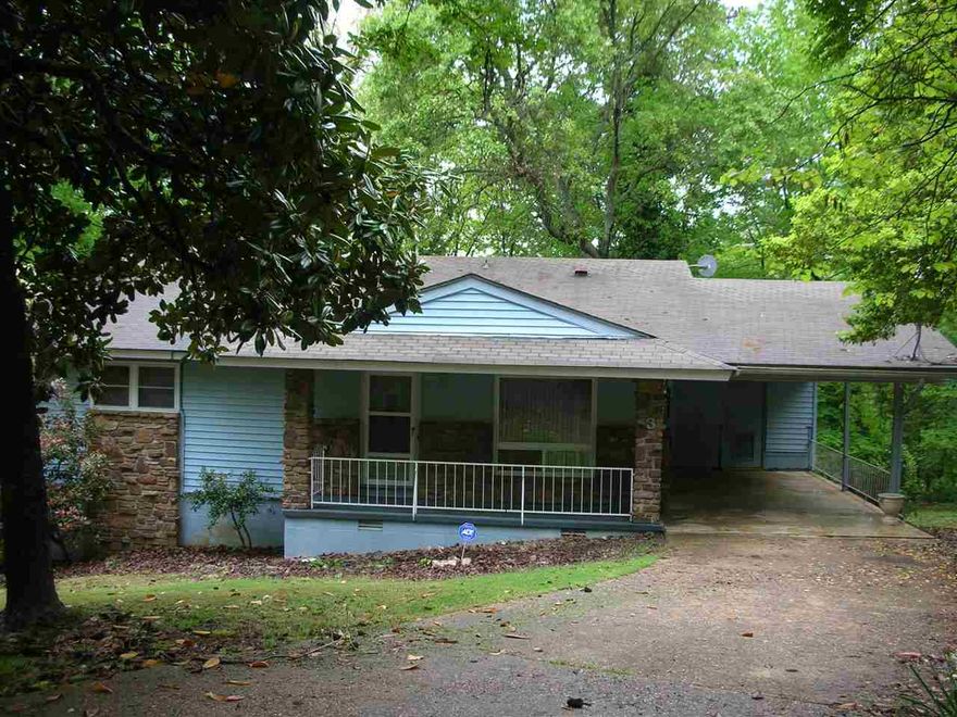 GREAT VALUE in this 3 bedroom, 2 bath home with multiple living areas, two fireplaces and multiple covered decks.  Large carport with outside storage area.  Nicely landscaped yard and low maintenance exterior.  Refrigerator, washer and dryer included with purchase.