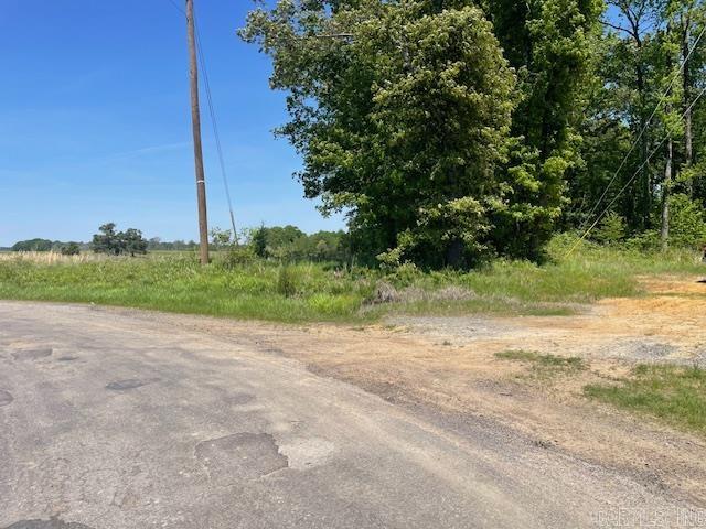 Great location with huge oak trees on roughly 15 acres to build your home. Grand Prairie Water and Entergy are available. Located off paved road. In the Carlisle School District.