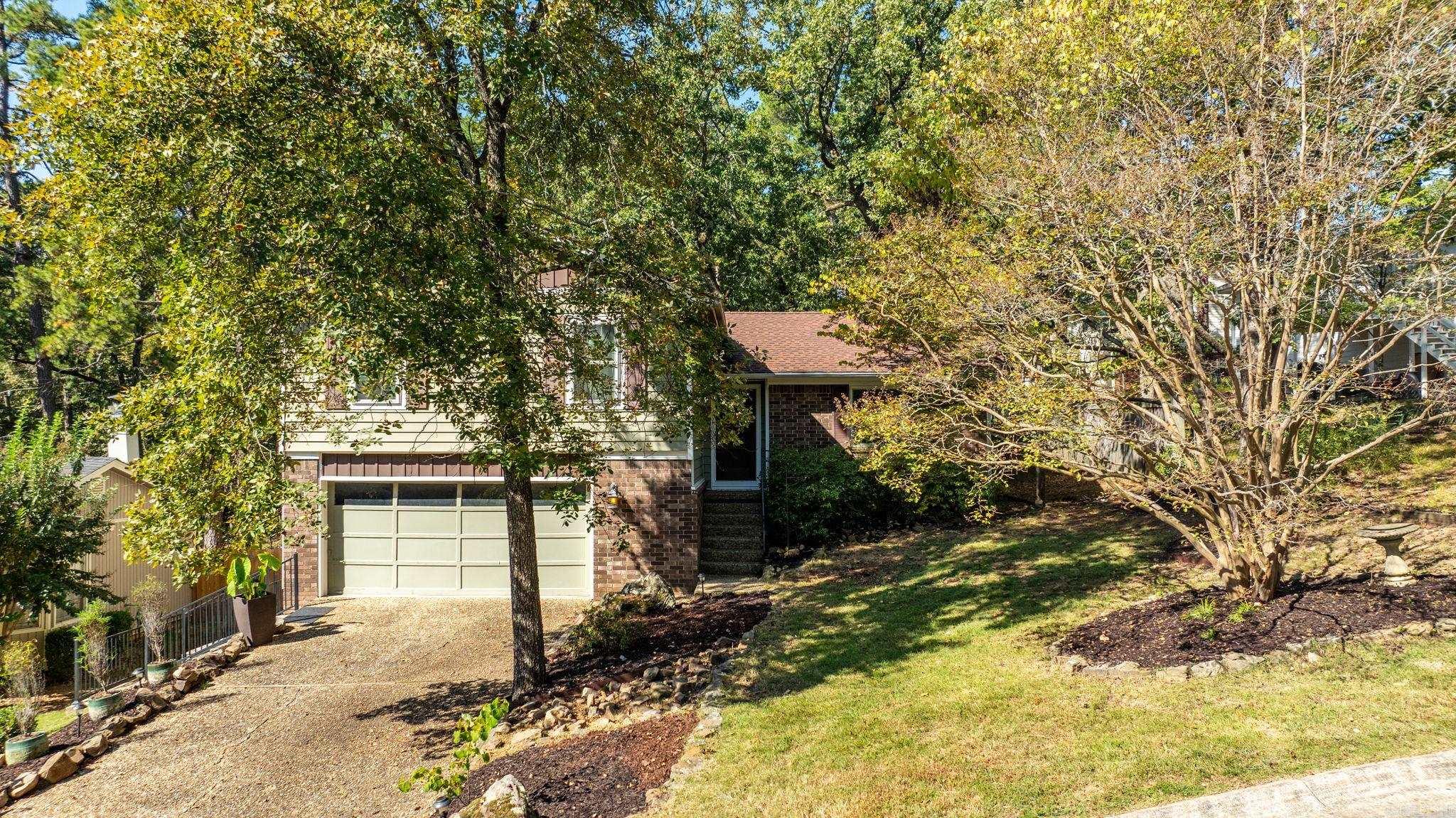 This is a wonderful home! So many updates and so well taken care of! This three bedroom home has a fantastic primary suite with a large walk in closet, a remodeled bathroom with pretty shower and a sitting area (or office or nursery) with bookshelves. Two other bedrooms share the updated hall bath with clawfoot tub. The kitchen was remodeled in 2020 with quartzite countertops, farm sink, breakfast bar, and custom cabinetry and brick floors. Off the kitchen is a three season room with windows with screens. This space does not count in square footage but is a lovely addition to the home. A door from the sunroom leads you to the new tiered deck (2025). There is a formal dining room off the kitchen. Downstairs you will find a family room with fireplace (ventless gas logs) a laundry area and half bath. New HVAC in 2024 with ten year extended warranty if service contract continues. New roof, including new decking, in 2022. New water line from home to the street in 2023. Too many updates to list them all! This wonderful home is a must see!