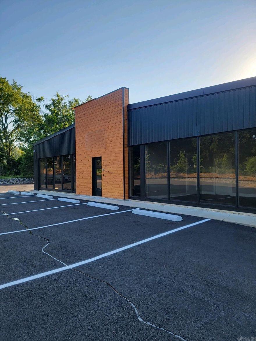 This commercial building has been newly remodeled inside and out! Centrally located just minutes from Oaklawn Racing Casino Resort and Historic Downtown Hot Springs. The available 660 square feet of contiguous office space is divisible to a minimum of 300 square feet. The building features several common areas including: a reception area, a fully equipped kitchen, a conference room, a training area, a break area, and restrooms. Tenant will be responsible for a portion of utilities and CAM fees based on the size of space leased.