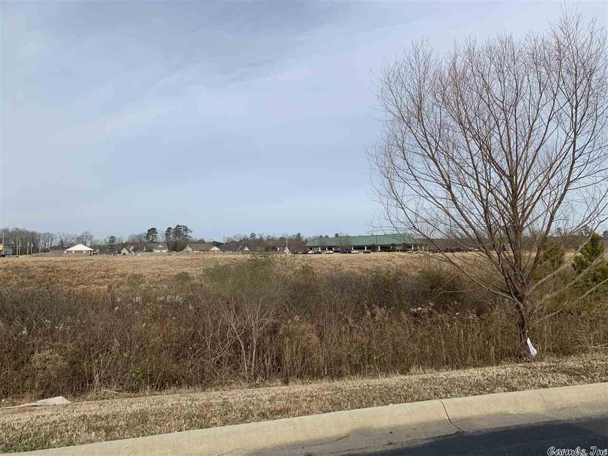 A GEM! This 3.57 acres would be ideal for your business venture. Property is located behind Tractor Supply, with a 25 ft strip between Fastenal and Tractor Supply for access from Highway 270 and also access from Jefferson Parkway. Zoned commercial.