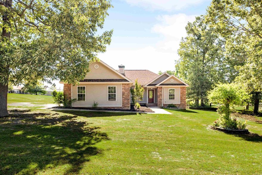 Welcome to 5315 Dew Trail! Situated on a RARE 1.55-acre lot, this move-in-ready home features FRESH paint, NEW luxury vinyl plank flooring, and NEW modern kitchen appliances. With a roof just two years old and a new hot water heater, you can enjoy peace of mind! This home checks all the boxes!! The level lot offers plenty of outdoor space, and the two-car garage provides ample storage. Enjoy hanging out with friends and family on your back porch or chilling by the fireplace on those cozy nights! Property is RD eligible.  Lot line drone photos will be added. Virtually staged.