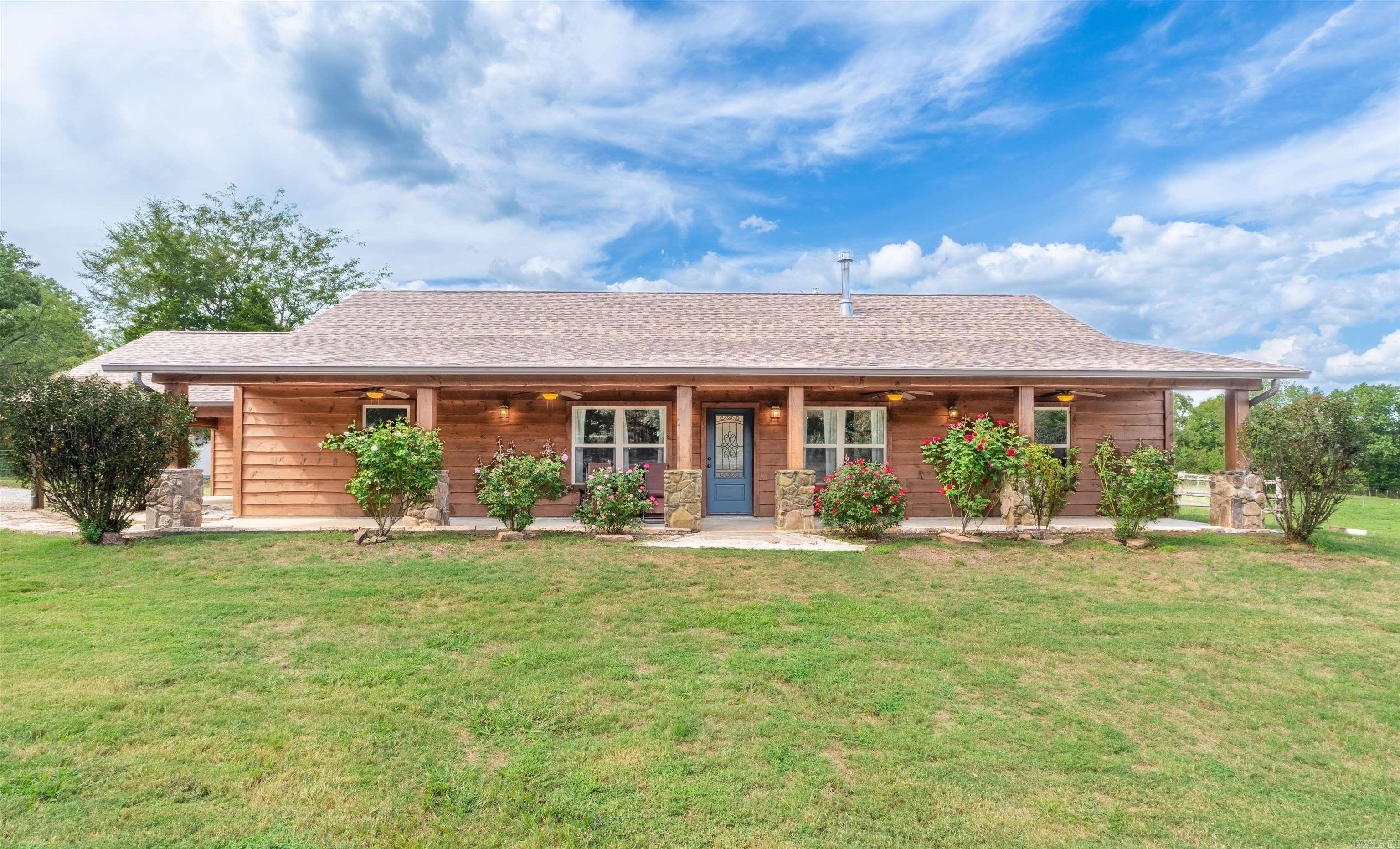 Country Living!!! 3 Bed/2 Bath home with a shop, barn & pond on 12.18 acres in Vilonia. Inside, you'll find new flooring & carpet, a cozy wood-burning fireplace, and a warm farmhouse feel throughout. The Kitchen features updated appliances (2021) and a bright, practical layout for family meals or entertaining. Outside, the property includes a shop with RV hookup and a bathroom, a four-stall horse barn, a pond and fruit trees including plum, peach, apple and pear- all ready for your projects, animals, or weekend adventures. whether you're looking to start a small farm, have room for horses, or simply enjoy a slower pace surrounded by nature, this one checks all the boxes. **PLEASE SEE AGENT REMARKS**