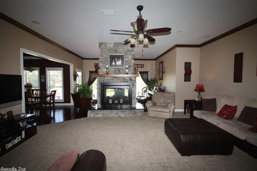 Custom built home on 1 ac lot with tons of upgrades.  Has 5BR/4BA with bonus room, concrete floors, granite counters, open kitchen with pantry, two dining areas, side entry garage, huge utility room w lockers, covered porch, hot tub, his/hers closets w fold out ironing board, 2 HVAC units, extra foam insulation in attic, solar board, vinyl windows, central vac system.  See online amenity sheet.  Agents see showing and confidential remarks.