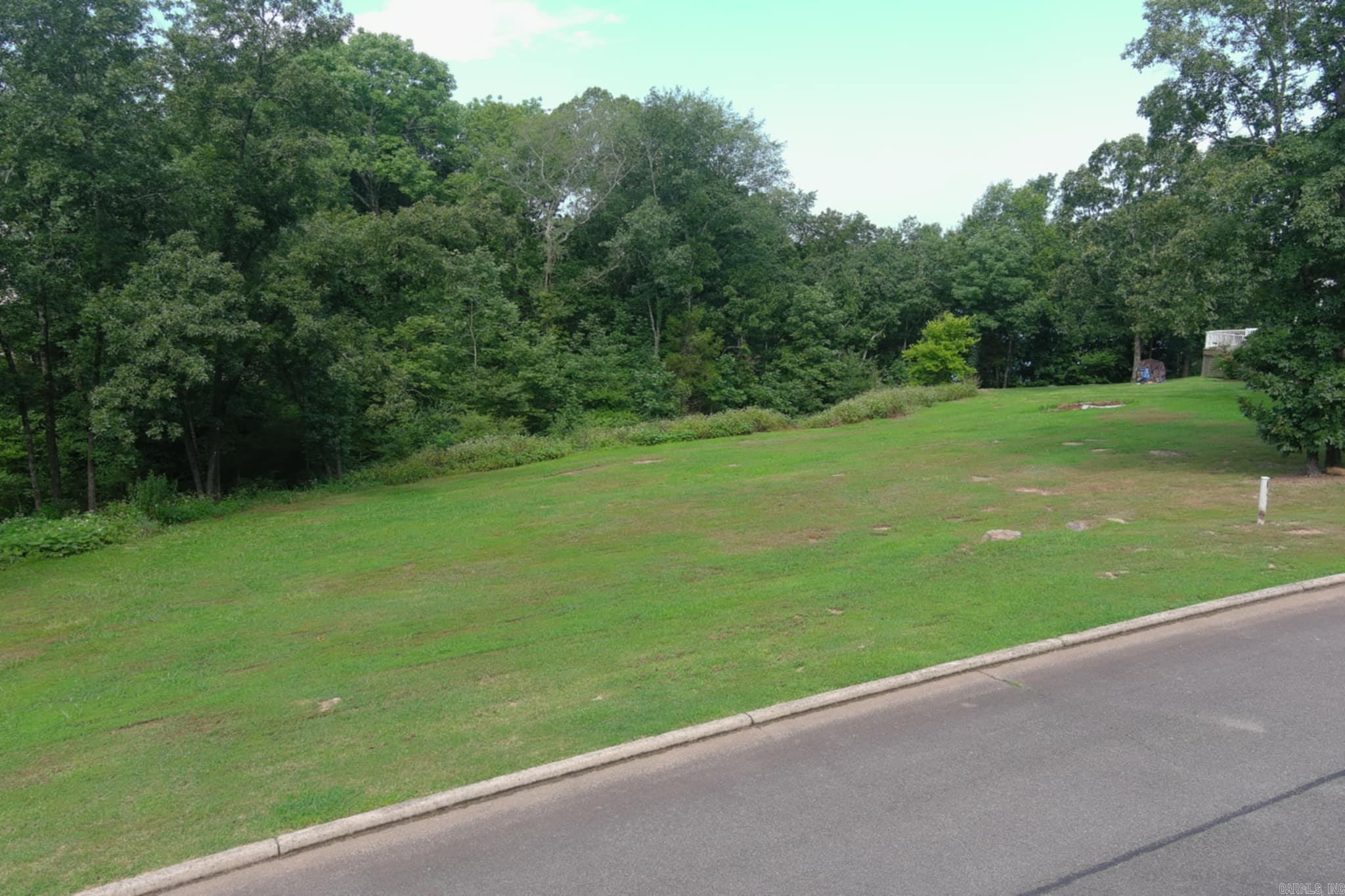 Large lakefront lot in exclusive gate subdivision. This is one of the few lots with walk in access to Greers Ferry Lake.